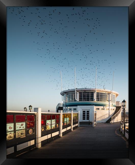 Starlings Over Worthing Pier Framed Print by Mark Jones