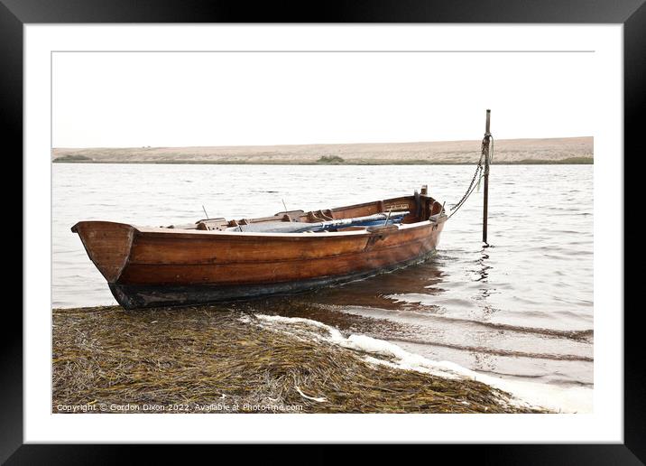 Rowing boat moored in Fleet lagoon, Chesil Bank, Dorset Framed Mounted Print by Gordon Dixon