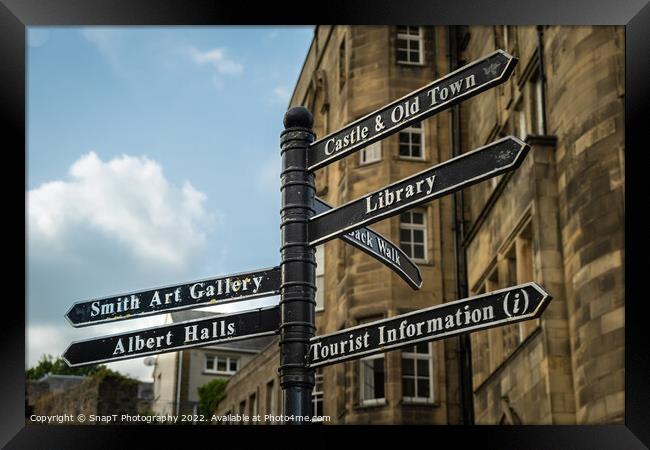 Sign post highlighting the directions to attractions in stirling town centre Framed Print by SnapT Photography
