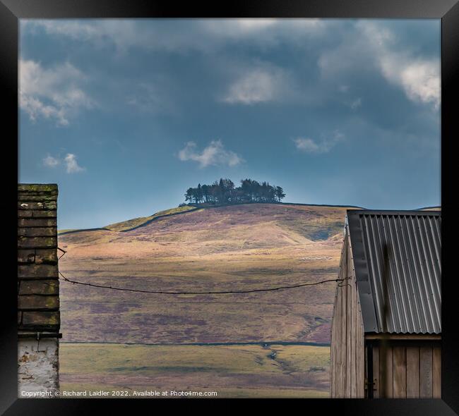 Kirkcarrion Between the Roofs Framed Print by Richard Laidler