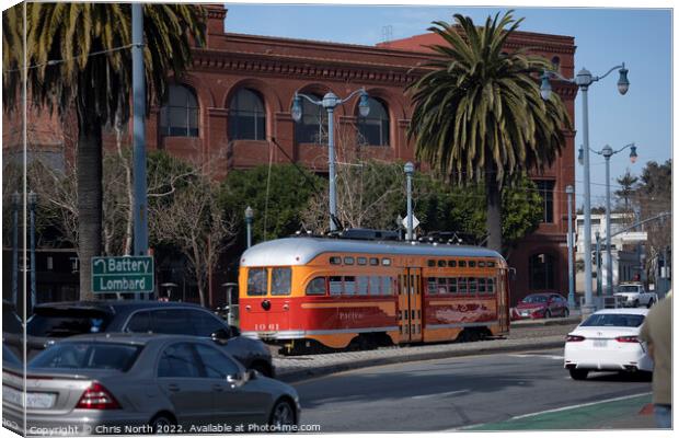 Trolley bus driving on the Embarcadero, San Francisco. Canvas Print by Chris North