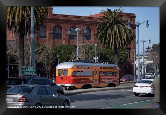 Trolley bus driving on the Embarcadero, San Francisco. Framed Print by Chris North