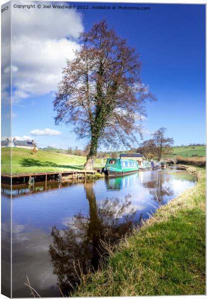 Walk Along The Canal Canvas Print by Joel Woodward