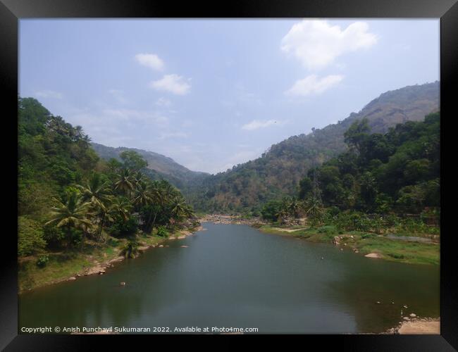 a river flowing between two mountain a view from Idukki Kerala Framed Print by Anish Punchayil Sukumaran