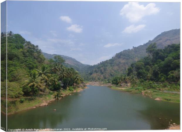 a river flowing between two mountain a view from Idukki Kerala Canvas Print by Anish Punchayil Sukumaran