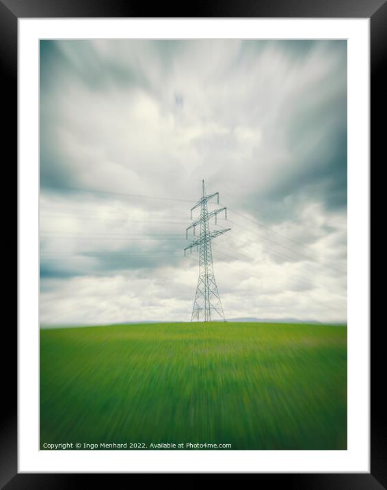 High voltage power line in the green field in Germany in the center of a radial blur Framed Mounted Print by Ingo Menhard
