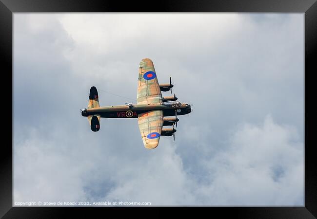 Avro Lancaster against a cloudy sky Framed Print by Steve de Roeck