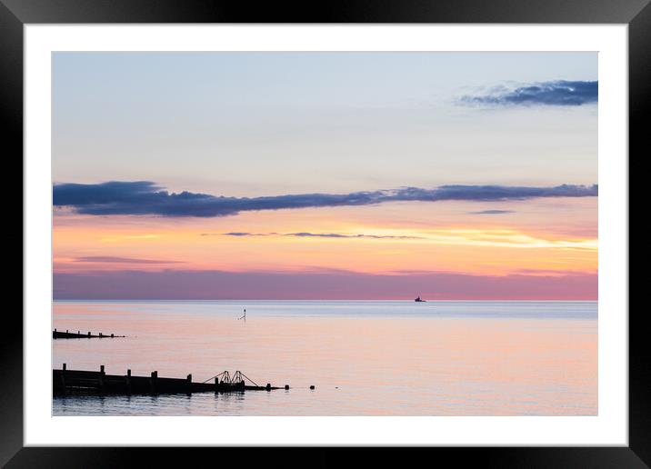 Groyne silhouettes at Cromer Framed Mounted Print by Jason Wells