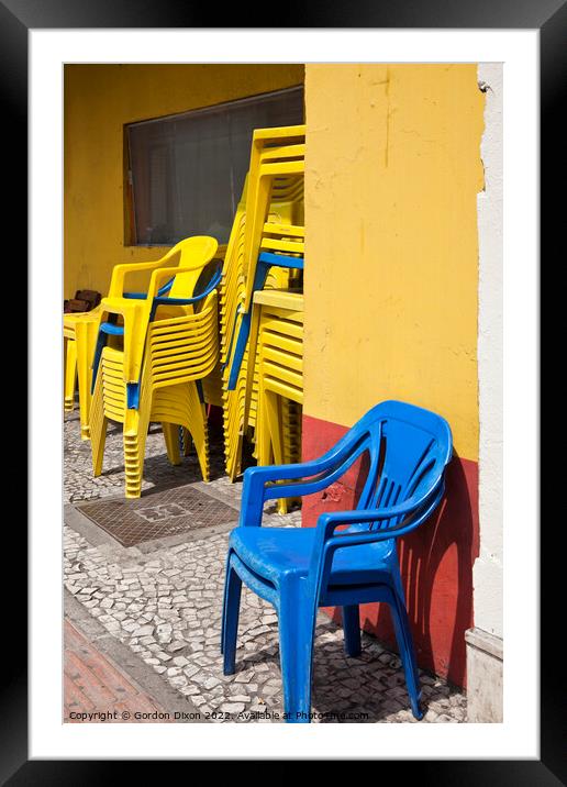 Colourful street scene - Stacking chairs - Curitiba, Brazil Framed Mounted Print by Gordon Dixon