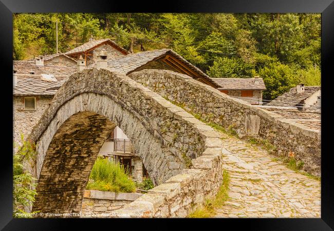  a   characteristic  bridge  of a piedmontese alpine village Framed Print by daniele mattioda