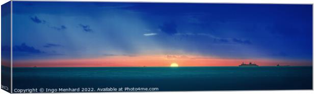A sunset over a body of water Canvas Print by Ingo Menhard