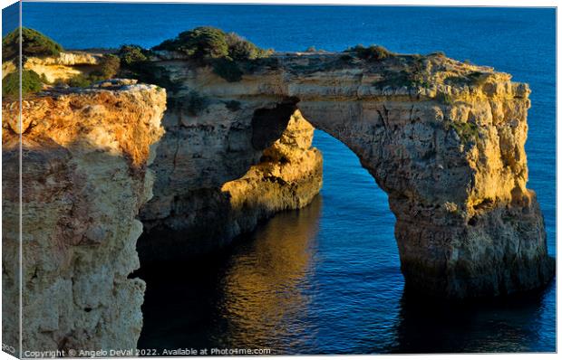 Cliff Arch in Albandeira Beach during Sunset Canvas Print by Angelo DeVal