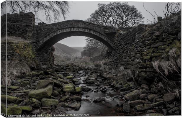 Woodland bridge in the mists Canvas Print by Richard Perks