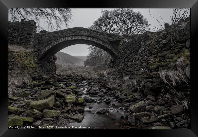 Woodland bridge in the mists Framed Print by Richard Perks