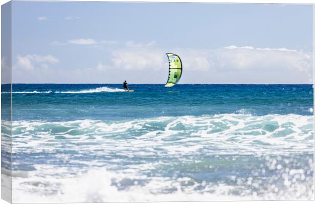 Kitesurfer on blue seas at  El Medano Tenerife Canvas Print by Phil Crean