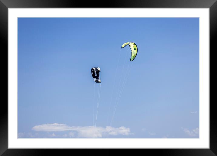 Kites against a blue sky Framed Mounted Print by Phil Crean
