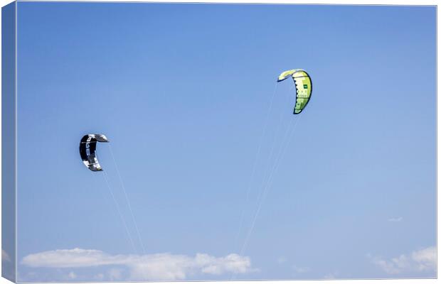 Kites against a blue sky Canvas Print by Phil Crean