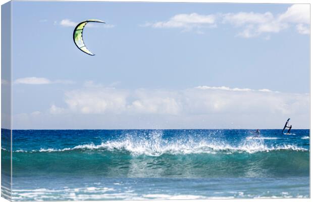 Kitesurfer on blue seas at  El Medano Tenerife Canvas Print by Phil Crean