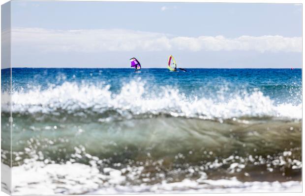 Windsurfers windsurfing on blue seas at El Medano Tenerife Canvas Print by Phil Crean