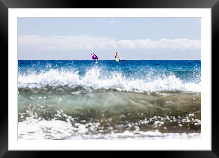 Windsurfers windsurfing on blue seas at El Medano Tenerife Framed Mounted Print by Phil Crean
