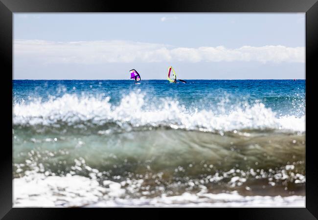 Windsurfers windsurfing on blue seas at El Medano Tenerife Framed Print by Phil Crean