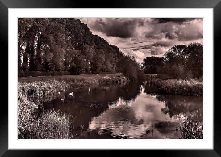 A body of water surrounded by trees Framed Mounted Print by Joyce Storey