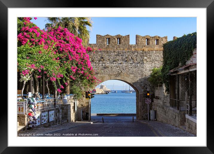 Looking through a gateway to the harbour, Rhodes Town, Greece Framed Mounted Print by Kevin Hellon