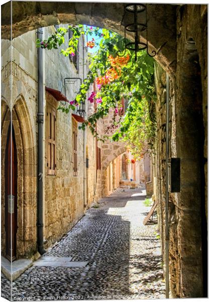 Narrow street in Rhodes old town, Greece Canvas Print by Kevin Hellon
