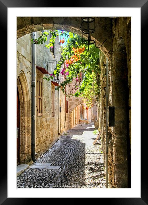Narrow street in Rhodes old town, Greece Framed Mounted Print by Kevin Hellon