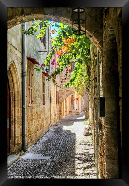 Narrow street in Rhodes old town, Greece Framed Print by Kevin Hellon