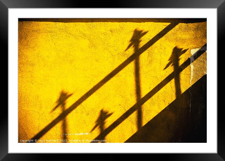 Four spears on yellow wall Framed Mounted Print by Ingo Menhard