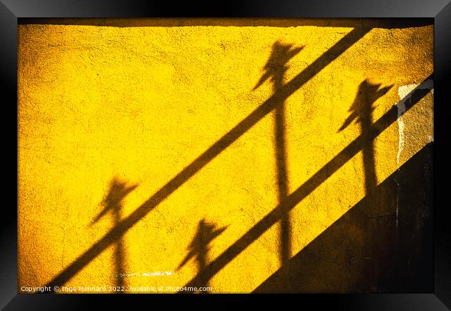 Four spears on yellow wall Framed Print by Ingo Menhard