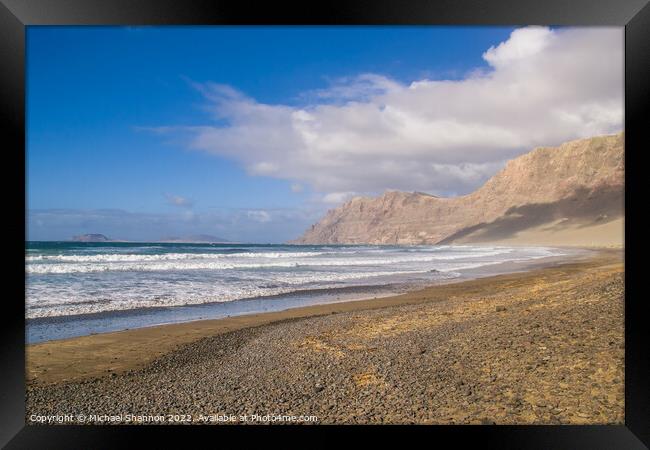 The beach and cliffs at Famara, Lanzarote Framed Print by Michael Shannon