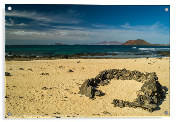 Rock beach shelter on Fuerteventura. In the distan Acrylic by Michael Shannon