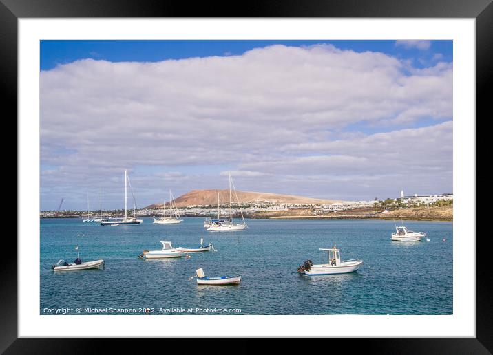 Small boats and Playa Blanca resort, Lanzarote Framed Mounted Print by Michael Shannon