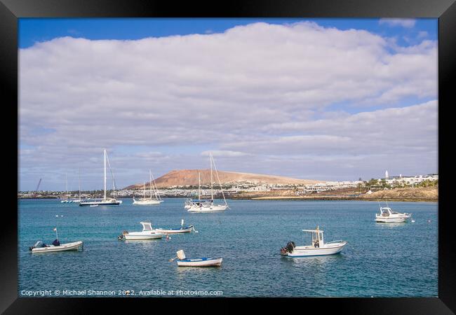 Small boats and Playa Blanca resort, Lanzarote Framed Print by Michael Shannon