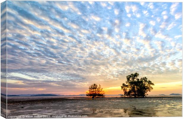 Trees at sunrise against a mackerel sky,  Canvas Print by Kevin Hellon