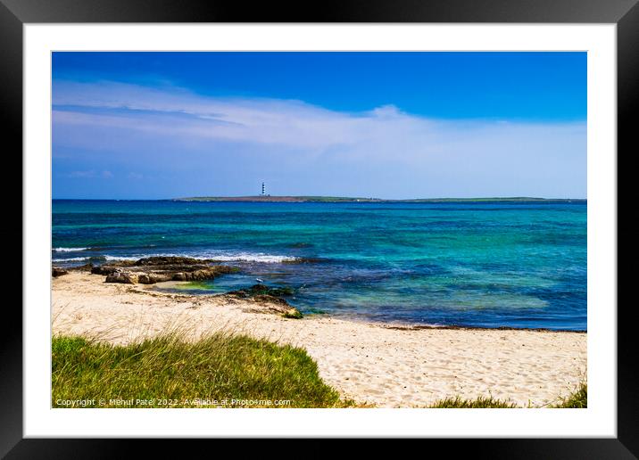 Deserted sandy beach at Punta Prima looking out to lighthouse on Framed Mounted Print by Mehul Patel