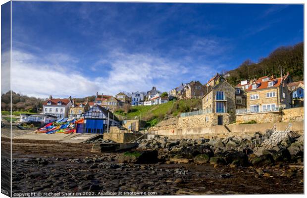 Cottages and boathouse in Runswick Bay, North York Canvas Print by Michael Shannon
