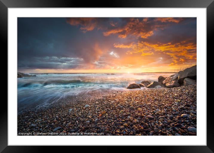 Stormy sea waves and foam at sunset. Marina di Cecina beach Framed Mounted Print by Stefano Orazzini
