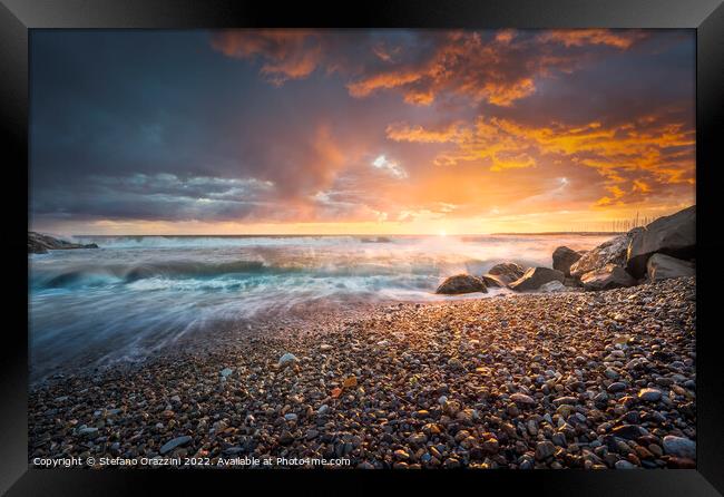 Stormy sea waves and foam at sunset. Marina di Cecina beach Framed Print by Stefano Orazzini
