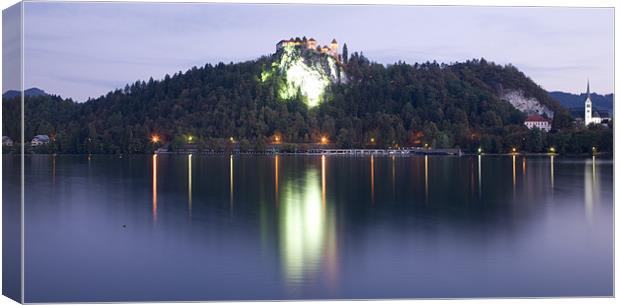 Lake Bled castle at dawn Canvas Print by Ian Middleton