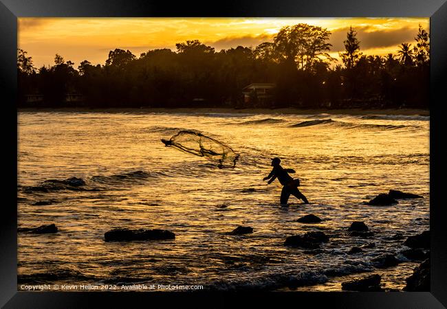 Fisherman at sunset Framed Print by Kevin Hellon