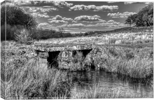 Granite bridge over Dartmoor stream Canvas Print by Roger Mechan