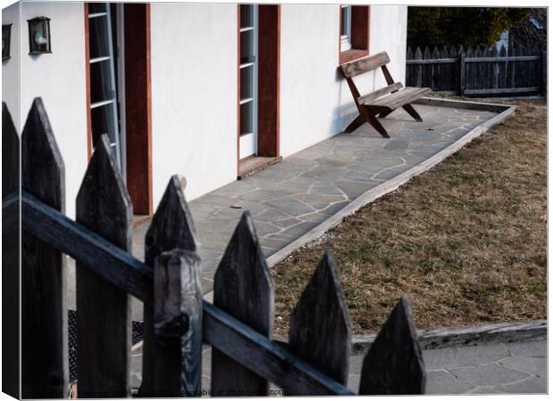 Wooden Bench in a Garden Canvas Print by Dietmar Rauscher