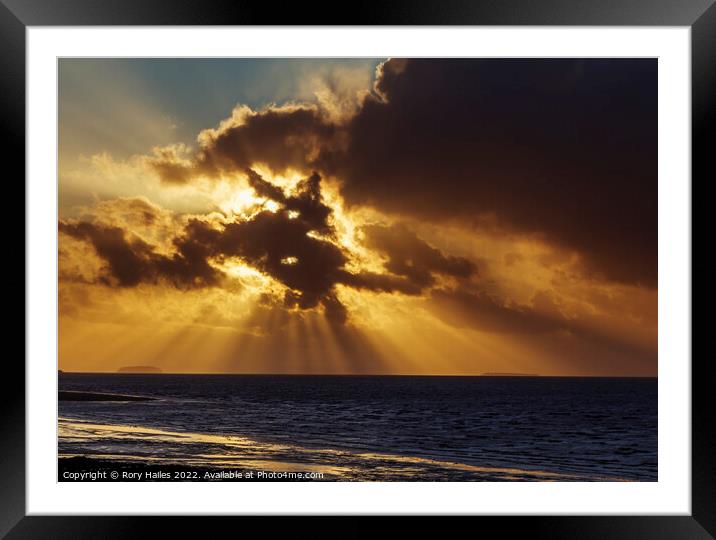 Crepuscular rays breaking through the cloud cover Framed Mounted Print by Rory Hailes