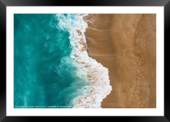 Top view of sand meeting seawater Framed Mounted Print by Stan Lihai