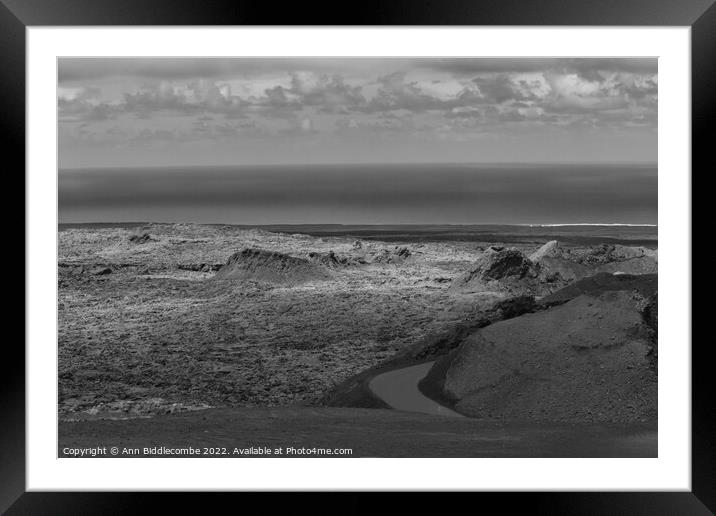 View to the sea over the volcanos in black and white Framed Mounted Print by Ann Biddlecombe