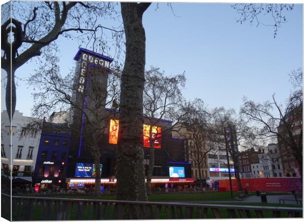 Twilight in Leicester Square Canvas Print by John Bridge