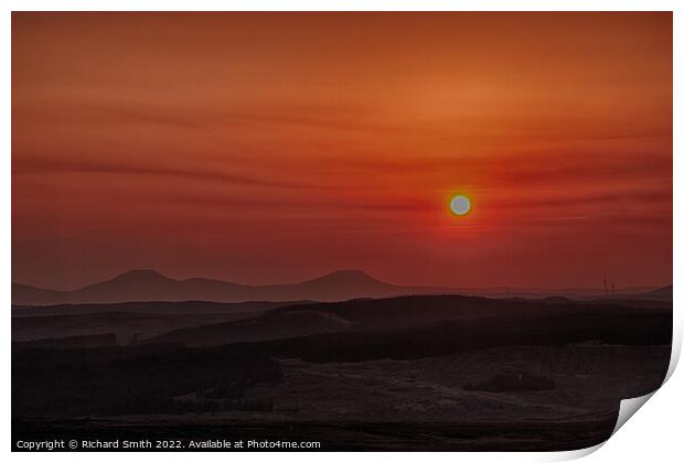 Sun setting through a low haze.  Print by Richard Smith